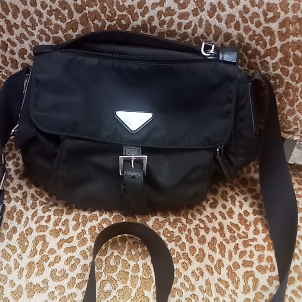 Prada  cross body bag in black, its been very good